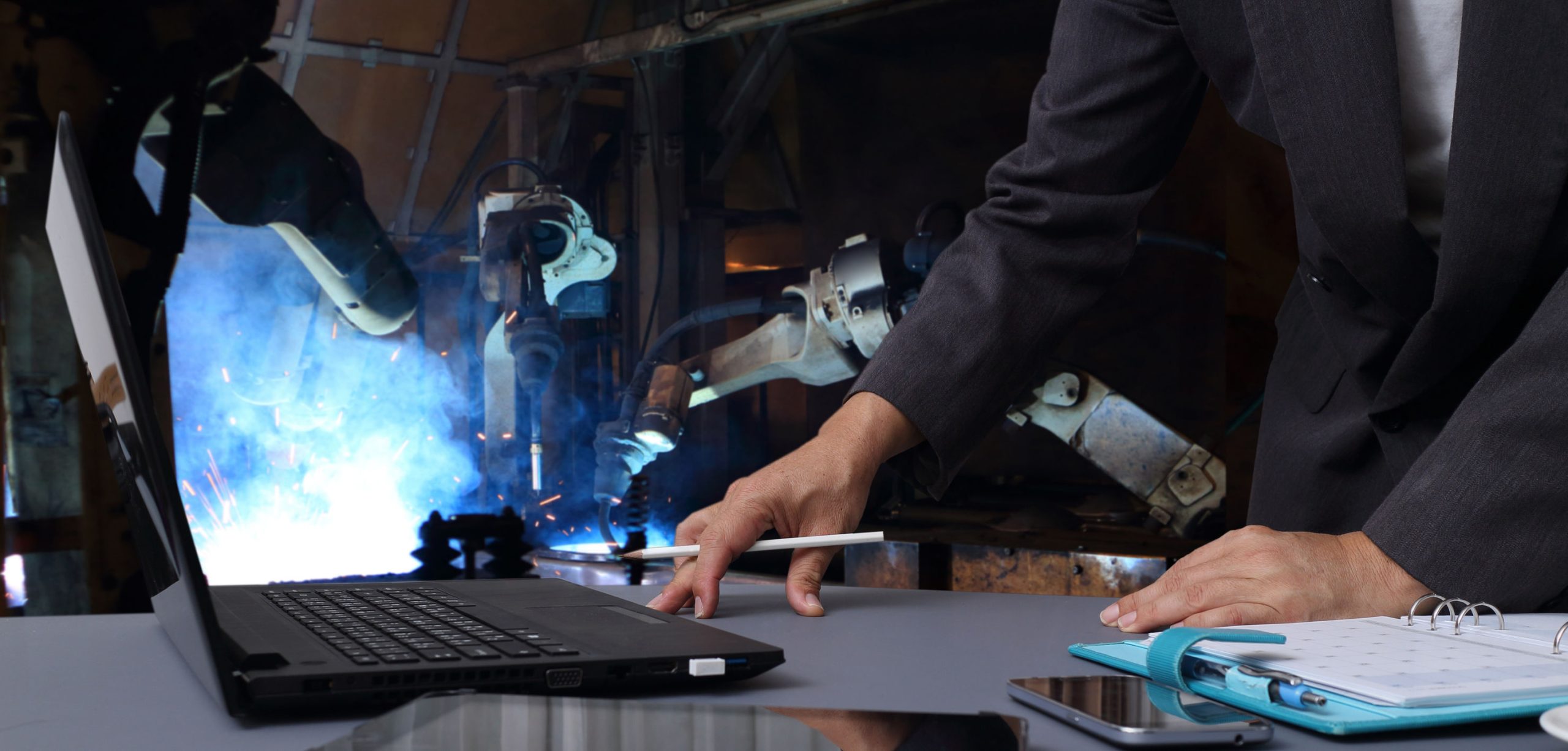 An engineer using CNC technology to perform plasma cutting