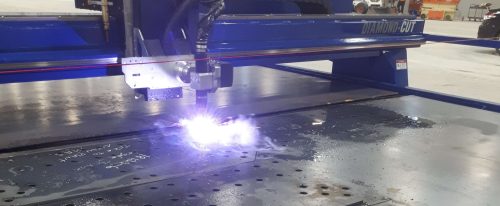 Plasma torch cutting shapes out of sheet metal