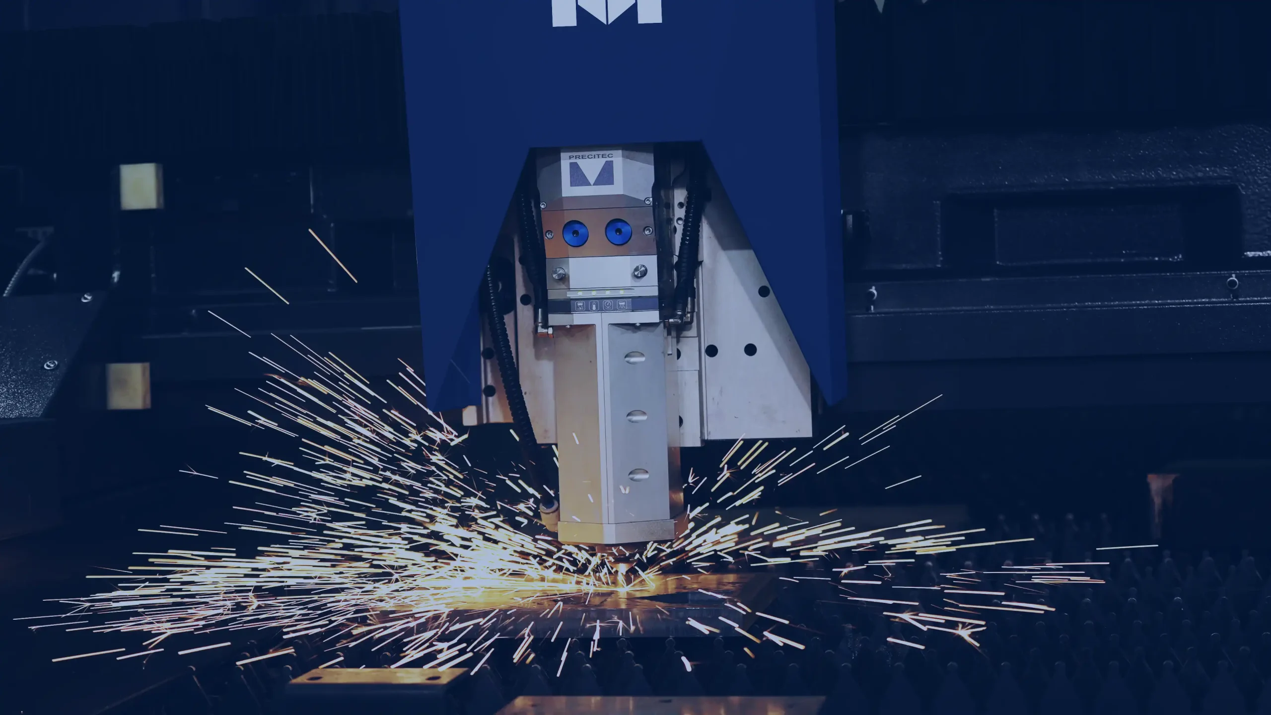 Close-up shot of a Machitech plasma cutter making a cut
